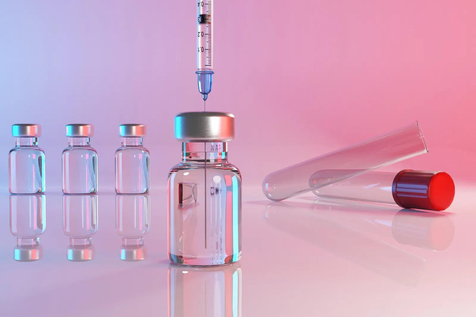 Medication vials and a syringe on a pink background