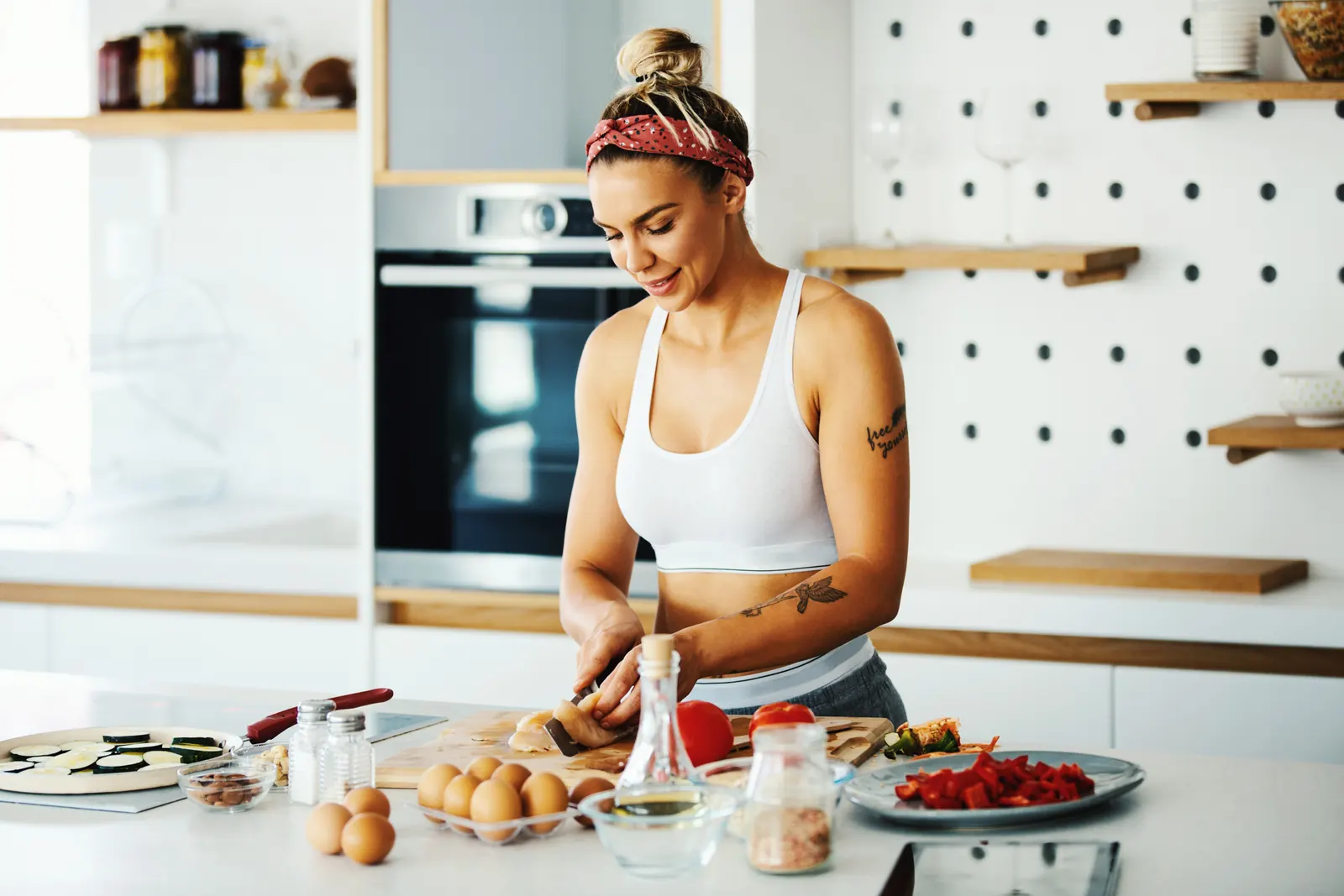 Woman preparing a colourful breakfast in her kitchen
